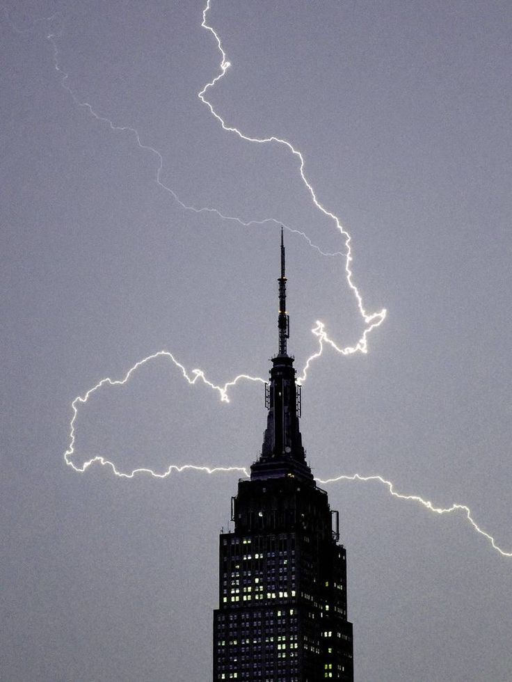 lightning strikes over the empire building in new york city, ny on july 29, 2012