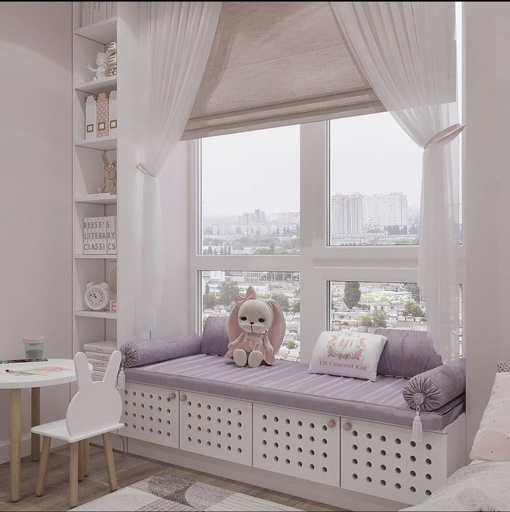 a white room with a window seat and stuffed animal