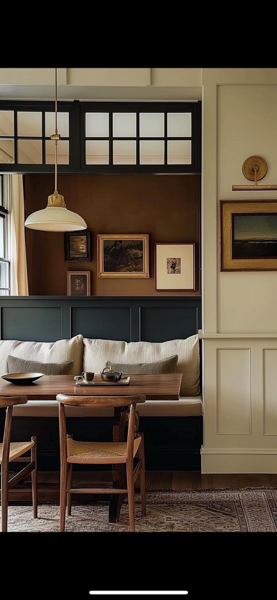 a living room filled with furniture next to a dining table and chairs in front of a window