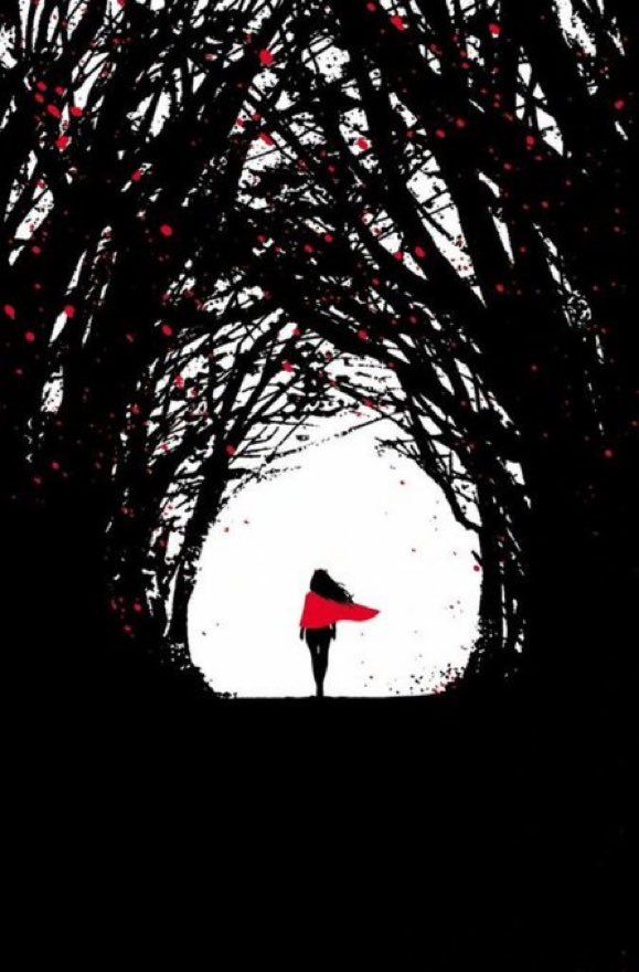 the silhouette of a person standing in front of trees with red umbrellas on them