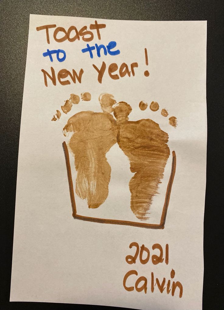 a child's hand and foot print with the words, toot to the new year