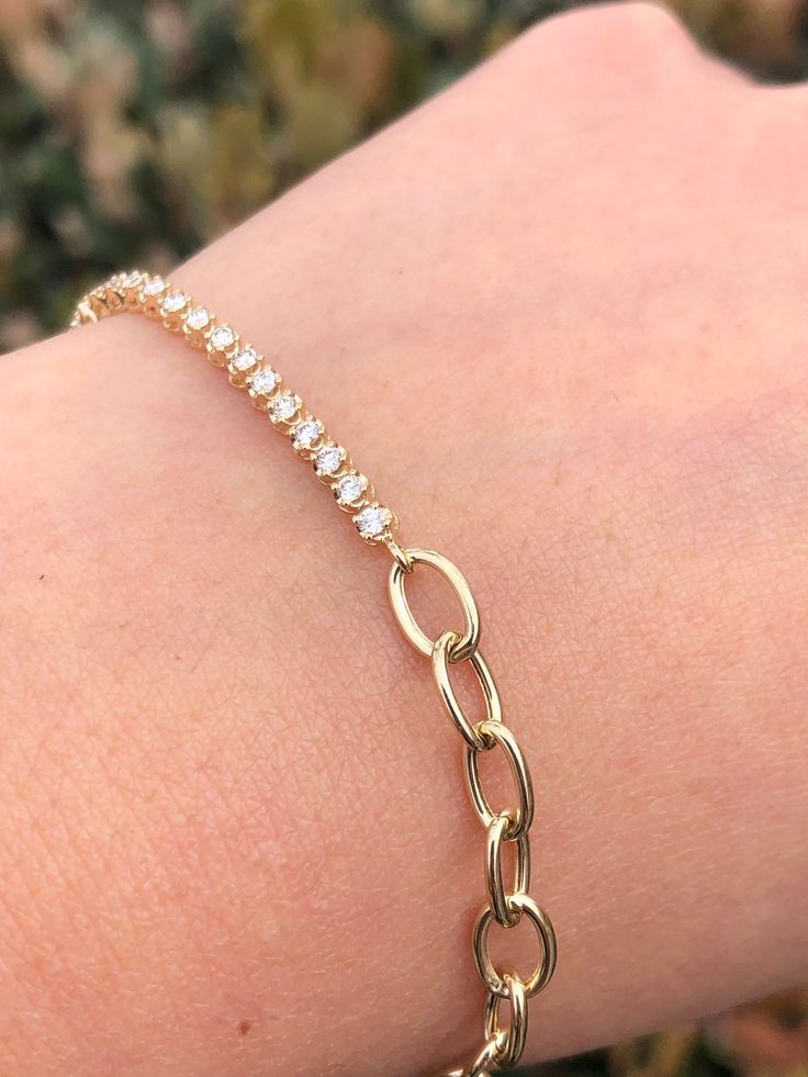 MaterialGold, Diamond DescriptionUp for sale is a beautiful 14K Gold Half Chain Half Round Tennis Diamond Bracelet. Specifications:-Model #: DHODHFTENNSHFCHN-Metal Type: Rose, White, or Yellow Gold-Metal Purity: 14K-Gold Weight: 3.2 grams approx.-Total Diamond Weight: 0.50-0.55 carats approx. -Length: Adjustable 6" or 7" -Color: F-G-Clarity: SI Brief Overview:-Free Sizing W/ Purchase-14 Day Return Policy-Conflict Free Diamonds-Satisfaction Guarantee-Black Velvet Box Included W/ Purchase.Satisfac Elegant Gold Bracelet With Adjustable Oval Chain, Elegant Gold Oval Bracelet With Adjustable Chain, Classic Diamond Bracelet With Chain, Elegant Round Diamond Bracelet With Solid Link Construction, Oval Diamond Jubilee Bracelet In 14k Gold, Oval Jubilee Diamond Bracelet In 14k Gold, Elegant Round Diamond Bracelet With Solid Link, 14k Gold Oval Diamond Jubilee Bracelet, Gold Chain Diamond Bracelets