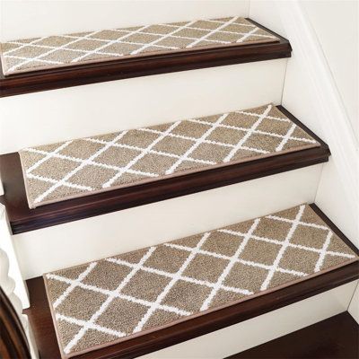 carpeted stair treads on the rise of a staircase