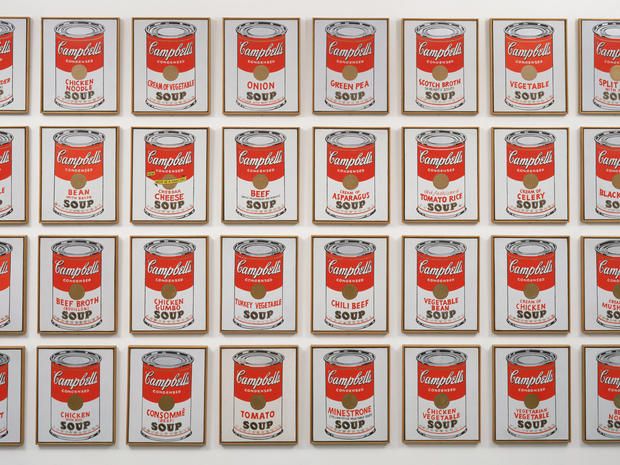 many cans of soup are arranged in the shape of a square pattern on a white background