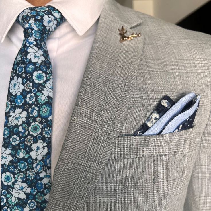 Handmade with 100% imported cotton fabric. Perfect for work, weddings or a night out on the town. This Floral Navy Blooms Tie will make you feel like the gentleman you aspire to be or accentuate the gentleman you already are. You’ll look good, feel good and do good things in this tie. Makes the perfect gift for a fellow gentleman or for that man in your life by making them look good and feel good. We guarantee your satisfaction with our free refund policy.* Goes Good With: Grey, Navy, Tan, Navy, Mens Floral Tie, White Canary, Dapper Day, The Gentleman, Square Art, Tie Shop, Wedding Ties, Modern Gentleman, Pocket Squares