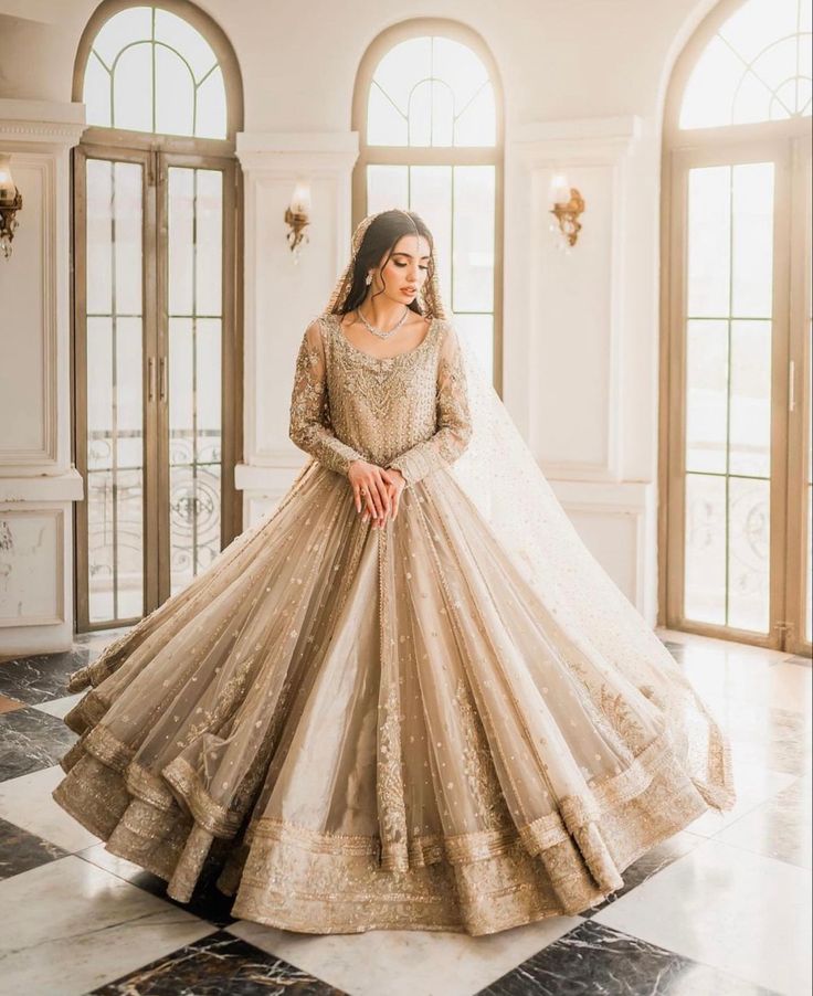 a woman in a wedding dress posing for the camera