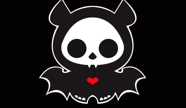 a black and white image of a skull with fangs on it's chest, holding a red heart