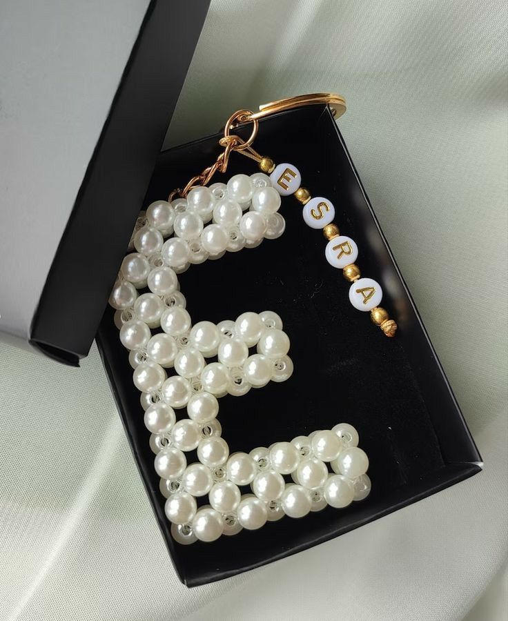 the letter b is made out of pearls