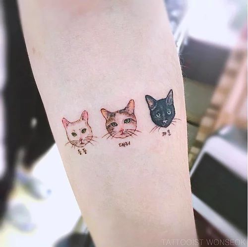 three cats tattoo on the left leg