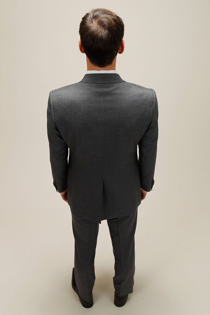 the back view of a man in a suit