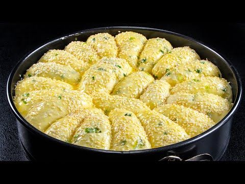 a pan filled with food sitting on top of a stove next to a black counter