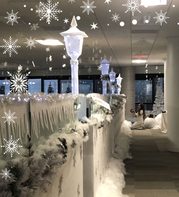 an office decorated for christmas with snow and lights