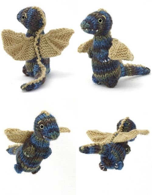 crocheted blue and beige dragon figurines with wings, on white background