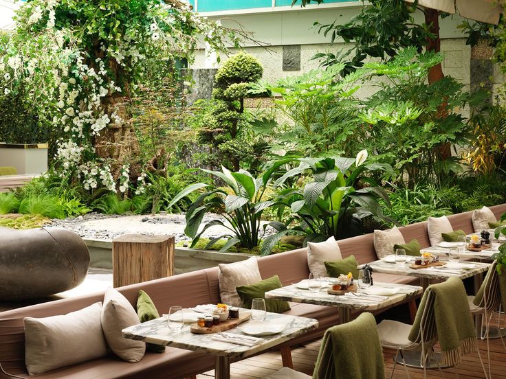 an outdoor dining area with tables and chairs