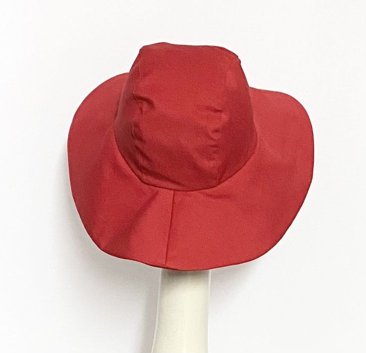 Wide Brim sun hat made with red cotton twill , lined in rayon print, the hat has a 2 section crown 3 1/2 " in length and a one piece 4" brim, a cotton band inside. One size fits most up to 23" Machine wash cold / hand dry Made in USA Press if needed / packable Fitted Lined Hats With Curved Brim, Fitted Hats With Curved Brim And Lining, Fitted Cotton Hat With Curved Brim, Fitted Lined Hat With Curved Brim, Red Adjustable Sun Hat For Kentucky Derby, Red Brimmed Sun Hat For Kentucky Derby, Adjustable Red Sun Hat With Short Brim, Red Bucket Sun Hat For Spring, Red Fedora Sun Hat For Spring