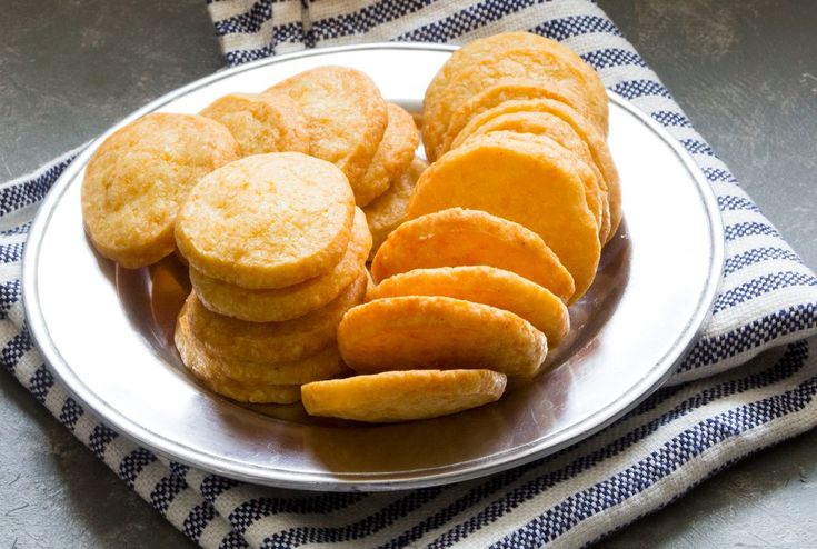 a white plate topped with cookies on top of a blue and white towel