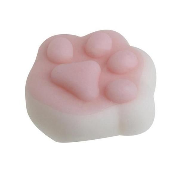 a pink gummy bear shaped soap bar on a white background