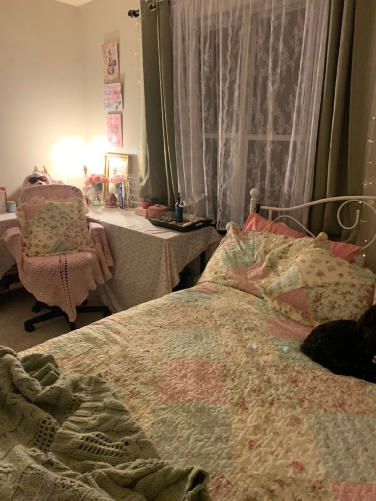 a bed room with a neatly made bed and a cat laying on top of it