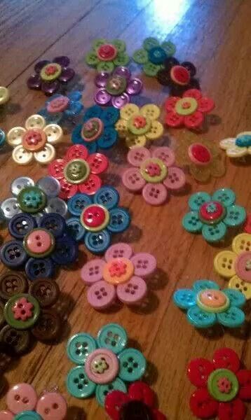 many different colored buttons are laying on the floor