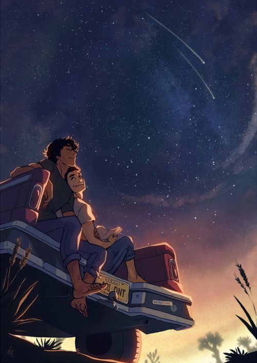 two people riding in the back of a truck under a night sky