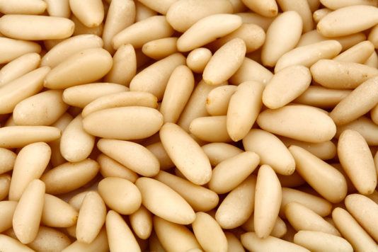 white beans are piled up together in this close - up photo, which appears to have been taken from above