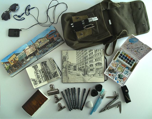 the contents of a bag are laid out on top of each other, including pens, scissors, markers and pencils