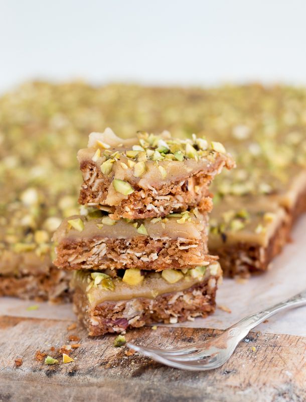 three pieces of granola bars stacked on top of each other with a fork next to them