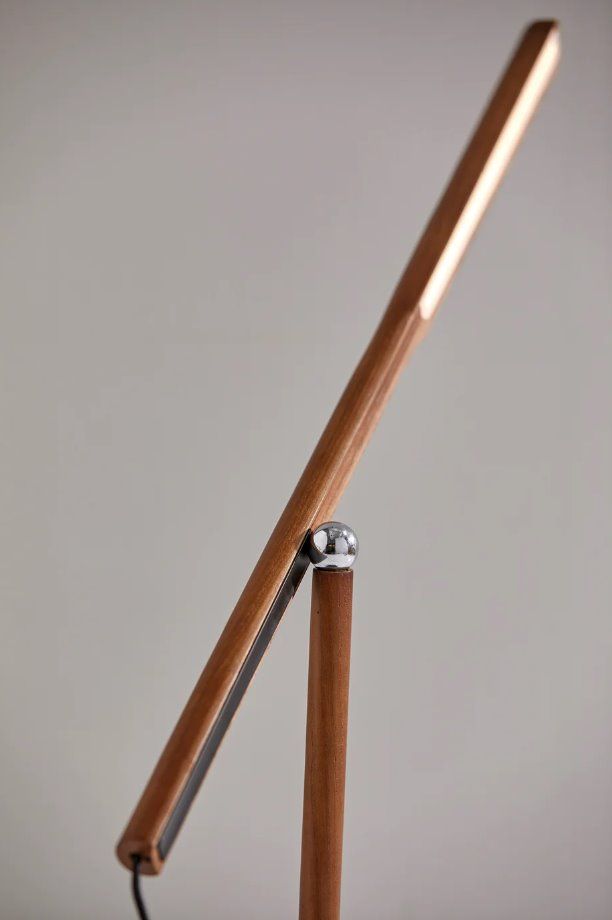 a close up of a wooden table lamp