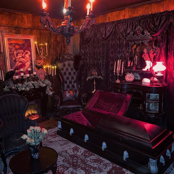 a living room filled with lots of furniture next to a fire place and chandelier