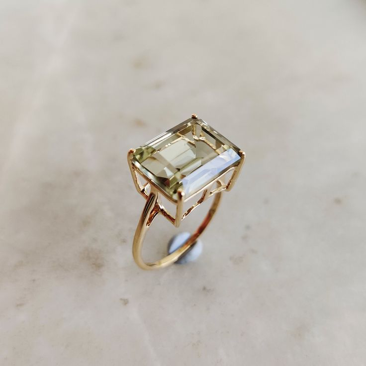 This stunning ring is set in 14k Solid Yellow Gold with Natural Green Amethyst with utmost precision. It is a unique statement gemstone ring for nearly every occasion and is completely hassle-free jewelry. 🔷ABOUT GEMSTONE: Green amethyst, also known as prasiolite, is a captivating variety of amethyst renowned for its ethereal, mint-green hue. This enchanting gemstone is celebrated for its connection to the heart chakra, making it a symbol of spiritual growth, compassion, and renewal. Green amet Green Amethyst Ring In 14k Gold, Fine Jewelry Yellow Gold Octagon Topaz Ring, 14k Gold Octagon Emerald Ring Fine Jewelry, Octagon Emerald Ring In 14k Gold, Oval Green Amethyst Jewelry In Yellow Gold, Yellow Gold Octagon Topaz Ring, Formal Citrine Solitaire Jewelry, Emerald Cut Green Amethyst Jewelry With Accent Stones, Yellow Gold Octagon Topaz Ring Fine Jewelry