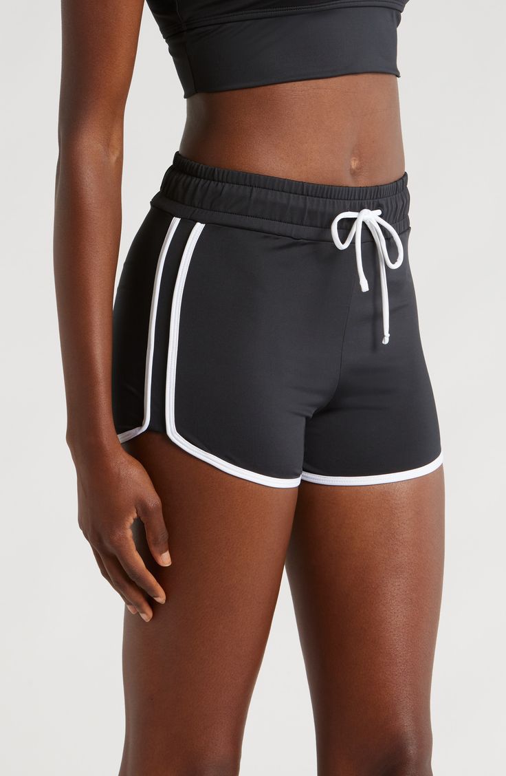 You will move with ease from land to sea in these stretch-enhanced swim shorts topped with a high waist. 3 1/2" inseam   Lined   80% recycled polyester; 20% spandex   Hand wash, line dry   Imported Sporty Black Swimwear With Built-in Shorts, Sporty Swim Trunks With Built-in Shorts, Summer Athleisure Activewear With Short Inseam, Athleisure Swimwear With Built-in Shorts, High-waisted Swim Shorts With Elastic Waistband, High Waist Black Shorts For Swimming, Black Nylon Shorts For Beach Season, Sporty Beach Activewear, Casual High-waisted Athletic Shorts With Contoured Waistband