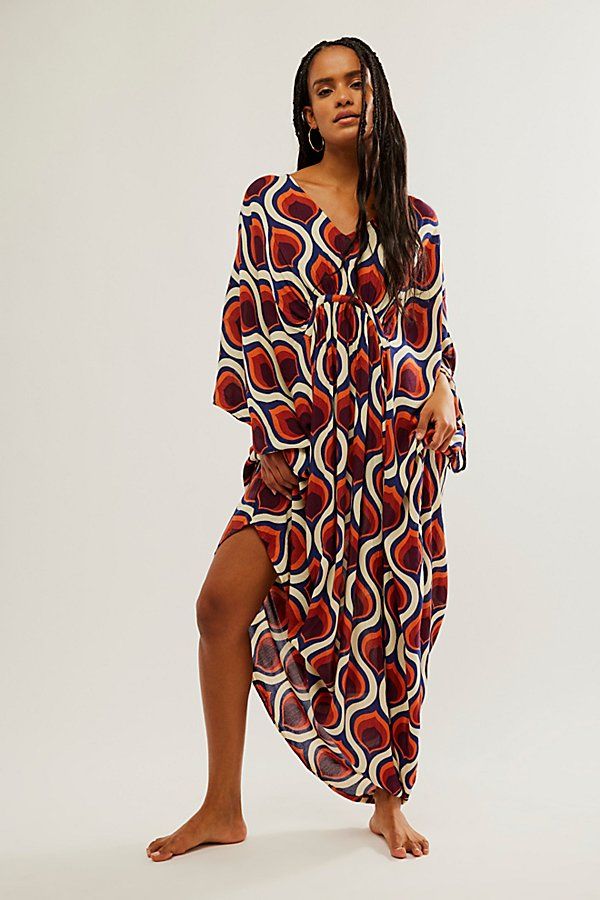 Billowy and breezy, vibrant and eye-catching, this so special kaftan is perfect for brunches, beach days, and everything in between. **Fit:** Maxi length, relaxed and oversized **Features:** Super mod, retro print, relaxed sleeves, pull-on style, deep-v neckline, ruched detailing, soft comfy fabrication **Why We | Groovy Baby Maxi Kaftan Dress by Free People in Yellow Vibrant Print V-neck Kaftan For Beachwear, Flowy V-neck Kaftan For Day Out, Maxi Length Beachwear Cover-up For Brunch, Bohemian V-neck Kaftan For Brunch, Summer V-neck Tunic With Vibrant Print, Chic Multicolor Maxi Dress For Beach Cover-up, Multicolor Beach Dress For Vacation Brunch, Flowy V-neck Cover-up For Brunch, Breezy Multicolor Maxi Dress For Beach Season