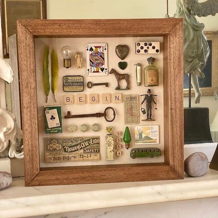 a shadow box filled with lots of different types of items on top of a table