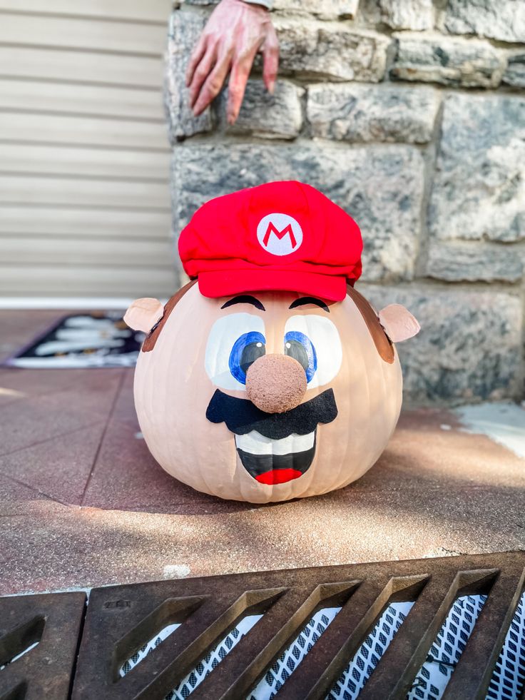 a pumpkin with an image of mario on it