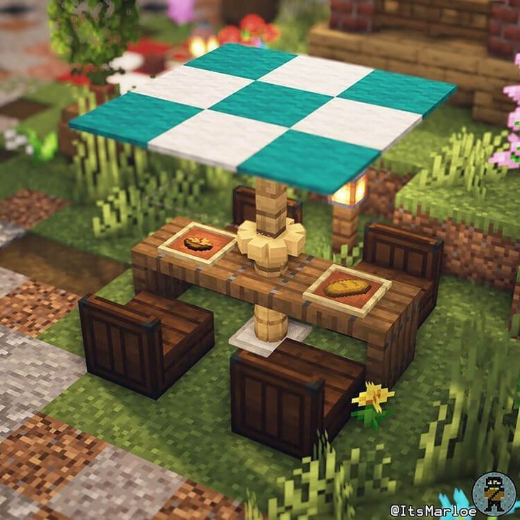 a picnic table in the middle of a garden