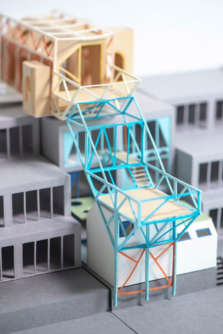 an architectural model of a building with multiple levels and different colored sections on each level