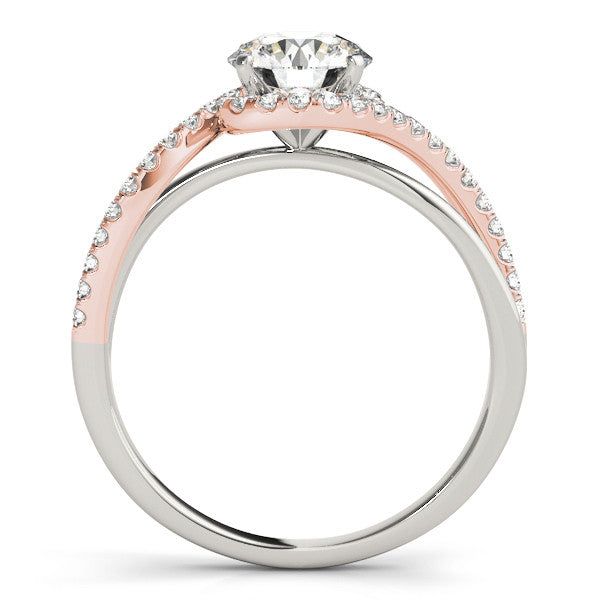 an engagement ring with two tone gold and white diamonds on the band, set in 18k rose gold