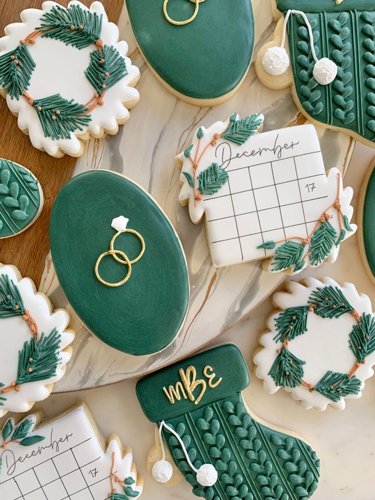 decorated cookies with wedding rings and calendars on them