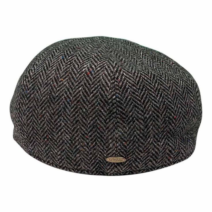 The flat cap, traditionally made of wool or tweed, has many advantages. Once worn by British and Irish farmers in the countryside, the flat cap has cycled through all social classes to become the burgeoning fashion accessory it is today. Enter the Wool Herringbone Flat Cap from Saint Martin — a flat cap that offers incredible value at a competitive price. The Herringbone Flat Cap A flat cap features soft fabric construction and a short, rounded front brim. Flat caps are constructed in two different ways, both of which feature a single-piece flat structure. Saint Martin is a reputable hat manufacturer that has been in business for decades. The brand's credibility for meticulous, high-quality construction is unparalleled. Product Description Featuring a comfortable sweatband, lined interior Outback Hat, Mens Hats Fashion, Flat Caps, Hat Stores, Cap Hats, Fabric Construction, Boy Hat, Leather Hats