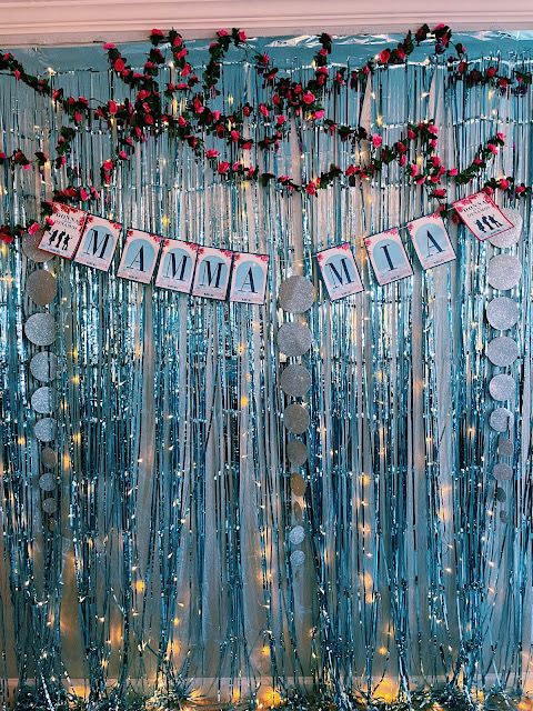 an image of a party decoration with streamers and decorations on the wall for a new year's eve celebration