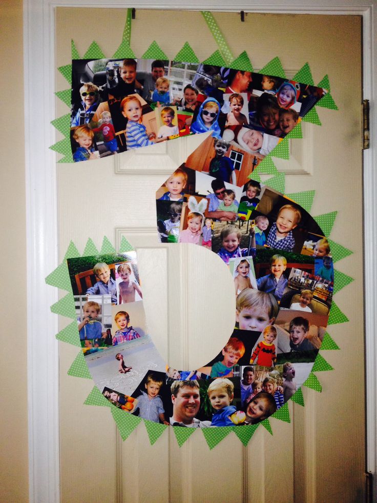 the letter c is made up of photos and green paper on a white door frame