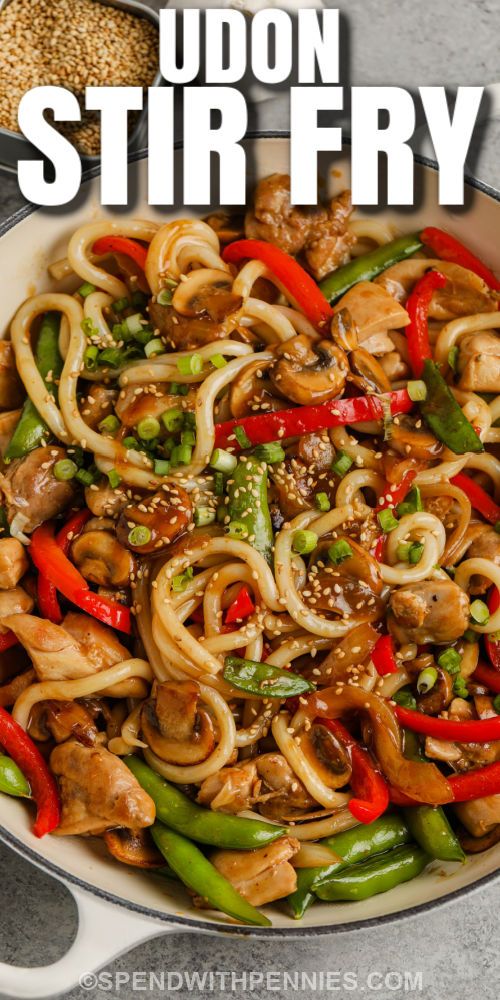 stir fry with chicken, peppers and onions in a skillet on the side text reads udon stir fry