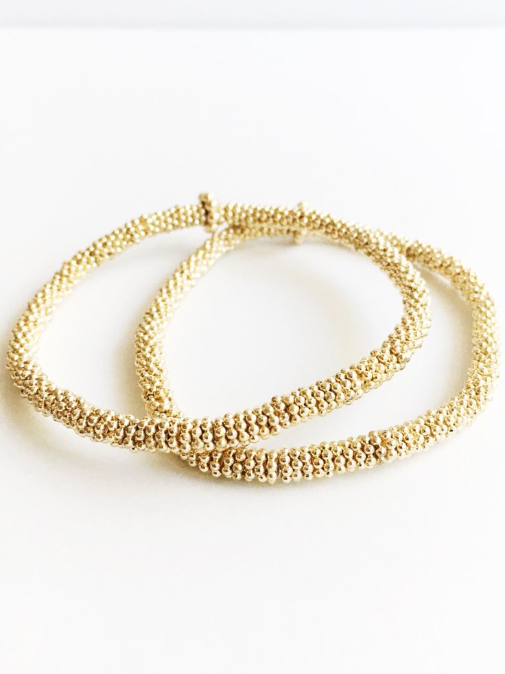 Two  Small 14kt Gold Fancy Flower heishi beads Confetti Beaded Bracelet Gold Beaded Bracelet With Tiny 14k Gold Filled Beads, Gold 14k Gold-filled Tiny Beaded Bracelets, Elegant Gold Stretch Bracelet Stackable, Elegant Stretch Bracelet With 14k Gold-filled Gold Beads, Elegant 14k Gold-filled Stretch Bracelet With Gold Beads, Flexible Gold Beaded Bracelets With Tiny Beads, Adjustable Gold Stretch Bracelet With Tiny Beads, Adjustable Gold Stretch Bracelet With Gold Beads, Adjustable Gold Stretch Bracelet Hand-strung