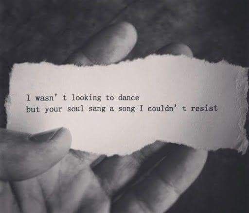 someone holding up a piece of paper that says i was looking to dance but your soul sings a song i couldn't resist