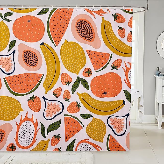 an orange and yellow shower curtain with fruit on it in a bathroom area next to a toilet