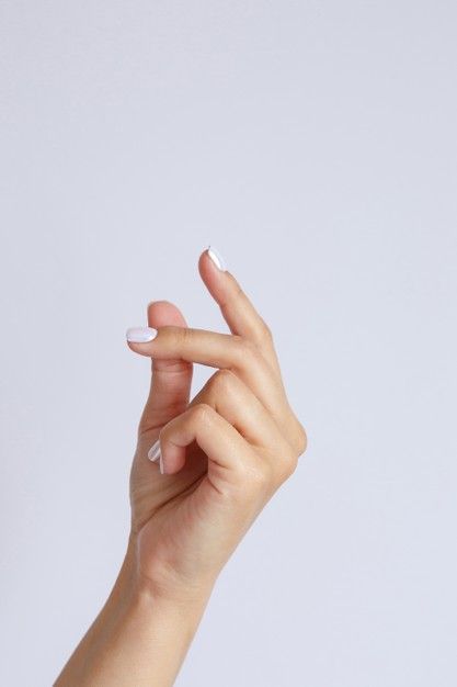 a woman's hand is holding up her fingers