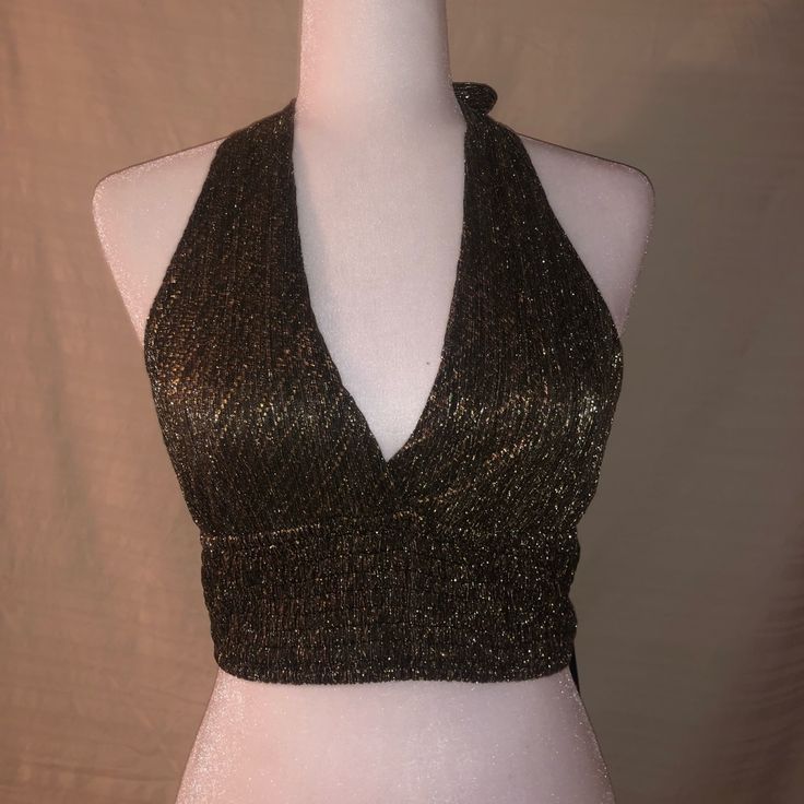 Black And Gold Brallette Tie Around The Neck And To The Back. Going Out Top!! Never Worn !! Glamorous Spring Halter Top For Night Out, Glamorous Halter Top For Night Out In Spring, Glamorous Halter Top For Spring Night Out, Trendy Fitted Halter Top For Night Out, Chic Gold Halter Top For Night Out, Chic Halter Top For Night Out And Party Season, Elegant Gold Crop Top For Night Out, Glamorous V-neck Crop Top For Night Out, Trendy Party Halter Top