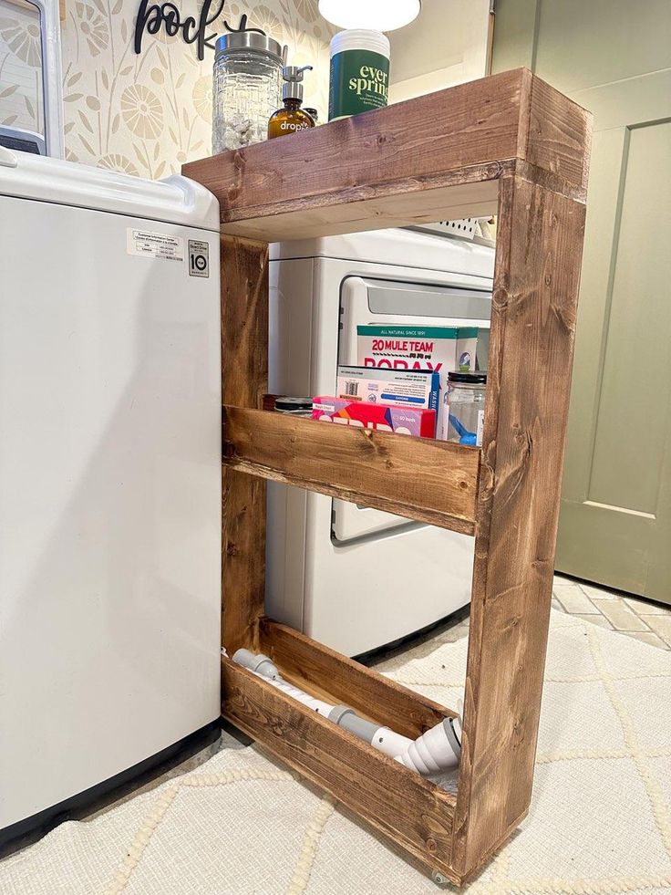 a wooden shelf next to a white refrigerator