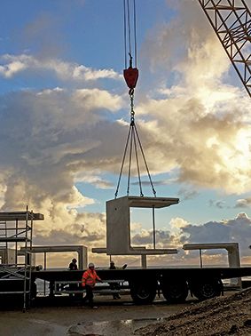 a crane lifting a large piece of equipment into the air