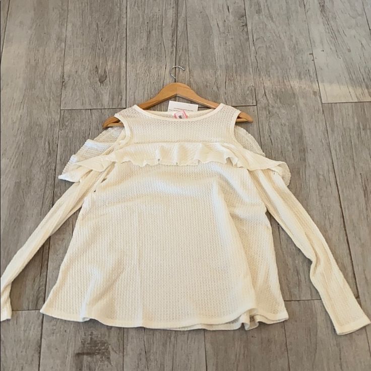 It’s A Cold Shoulder With Ruffles And Long Sleeve Cream Waffle Knit Tops For Spring, Spring Cream Waffle Knit Top, White Waffle Knit Tops For Spring, Spring White Waffle Knit Tops, White Winter Tops For Brunch, White Winter Top For Brunch, Colorful Sweaters, Cold Shoulder, Waffles